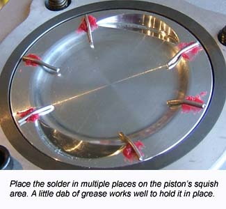 Placing solder on a piston